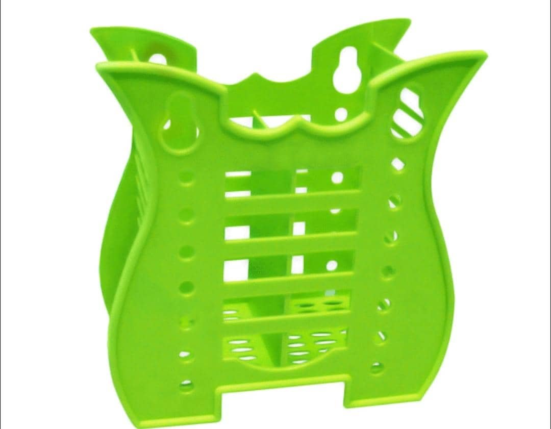 Green plastic tooth brush holder