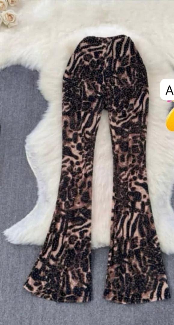 HIGH WAISTED ELEPHANT PRINT TROUSER.