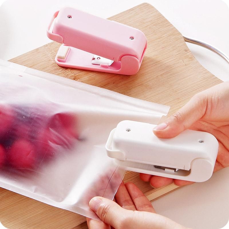 Mini sealing machine small household plastic sealing machine snack sealing artifact portable mini hand pressure plastic bag sealing machine White