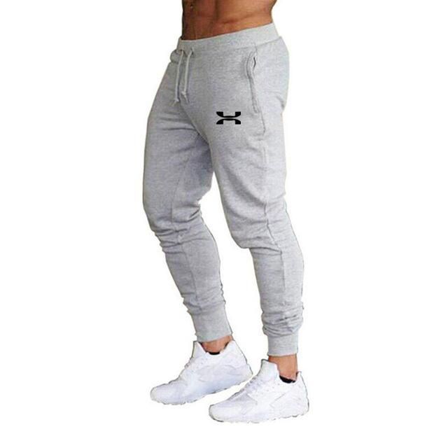 Informal cotton pants for men Solid tracksuit trousers Elastic feet for gym and sports