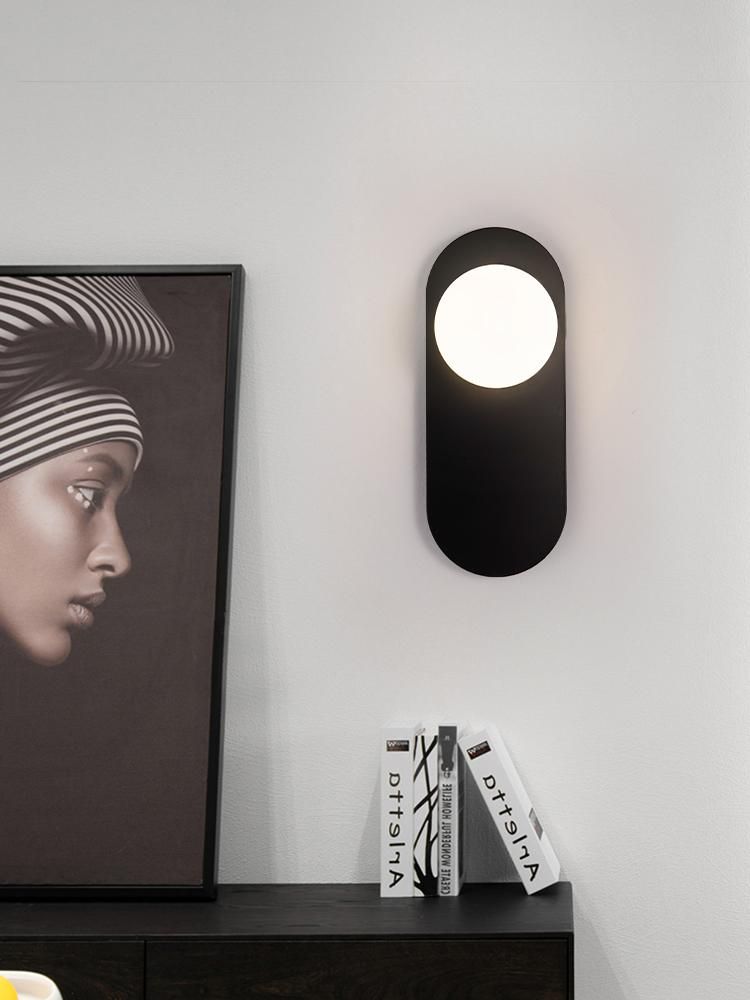 Minimalistic bedside wall lamp in the hallway