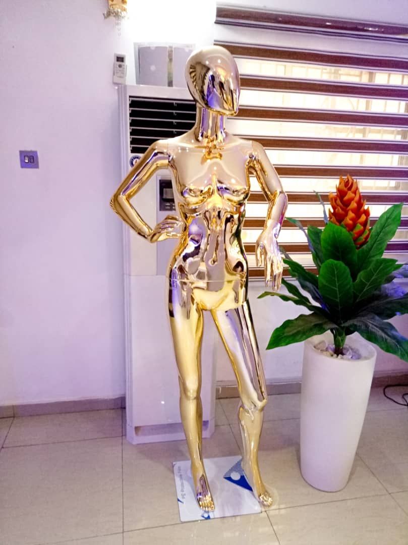 Stylish Gold Mannequin With Hand On The Waist