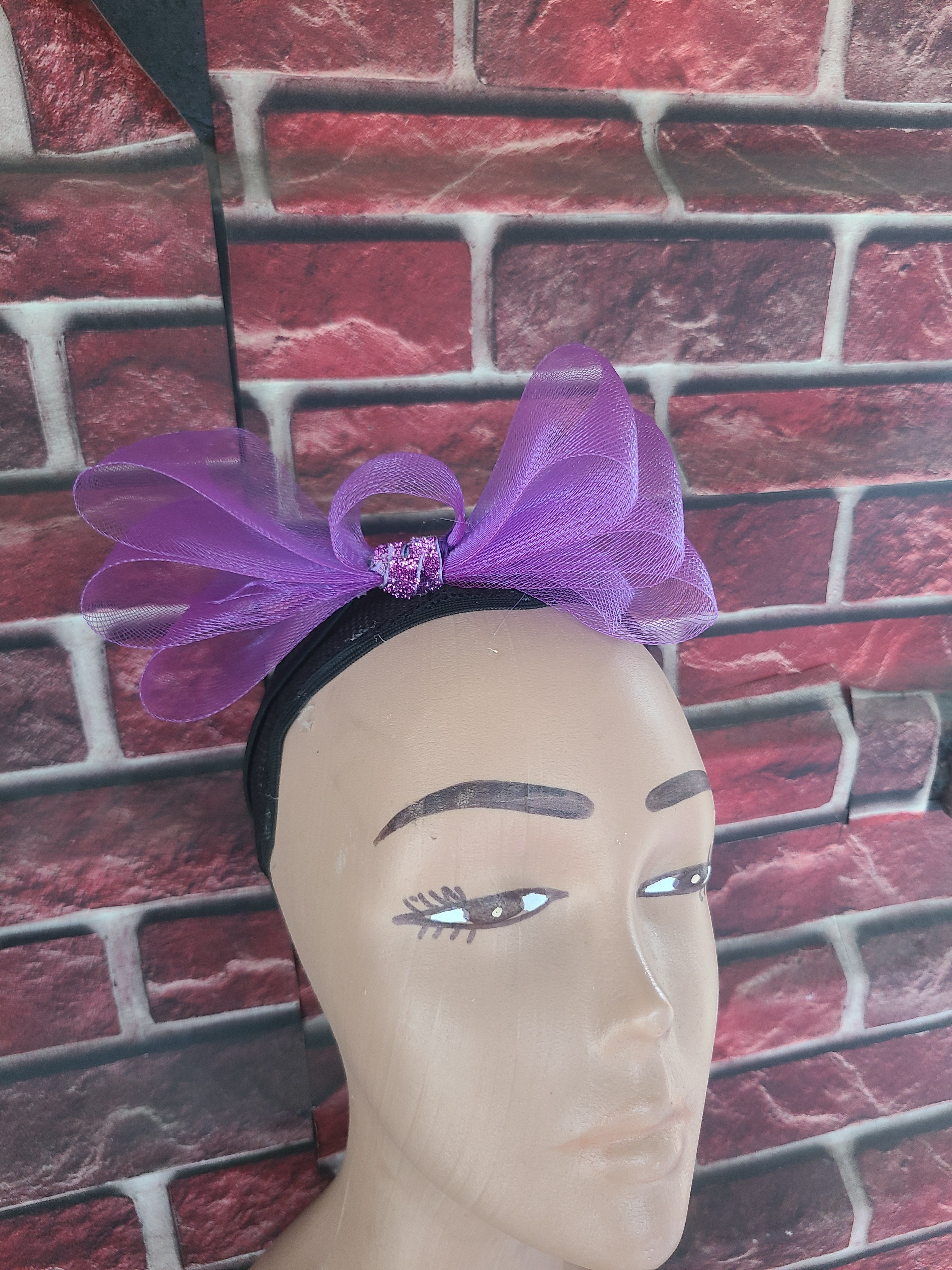 Purple bow fascinator