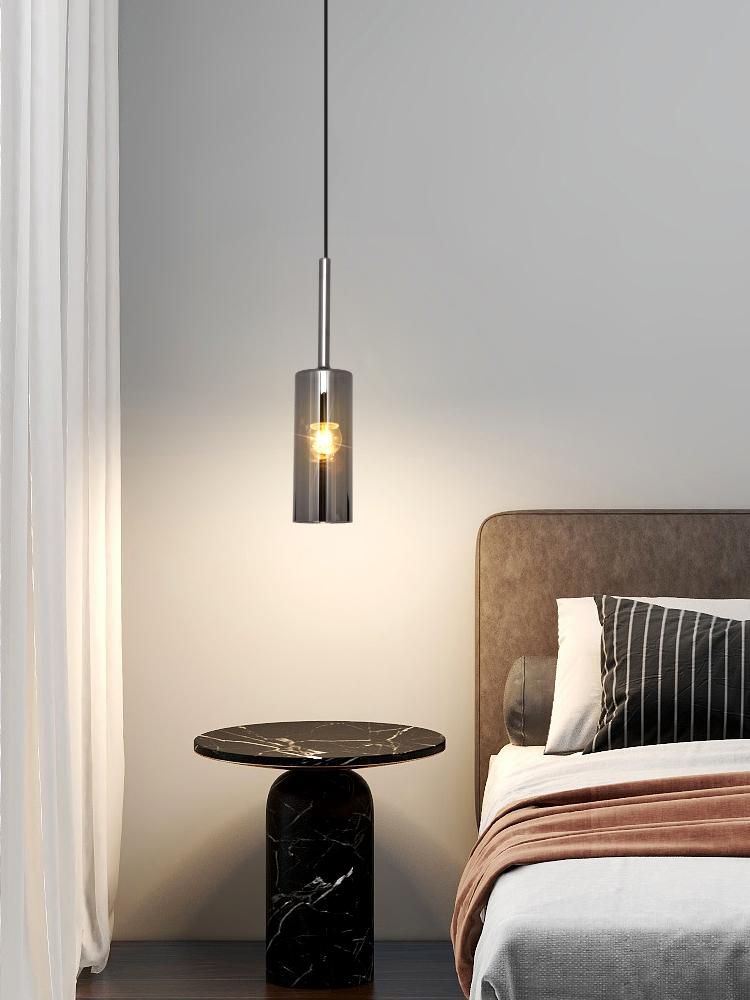 Modern minimalist bedroom dining room with a small chandelier