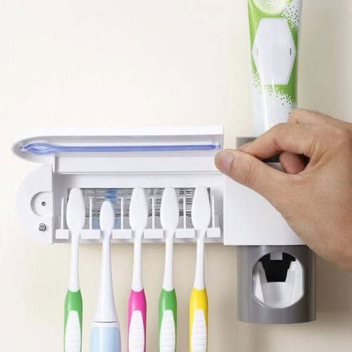 Tooth Brush Sterilizer And Tooth Paste Dispenser