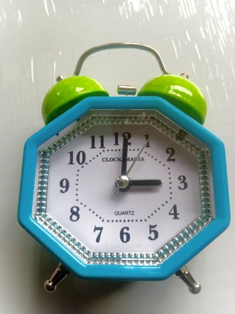 Blue Octagonal Alarm Clock With Green Bells