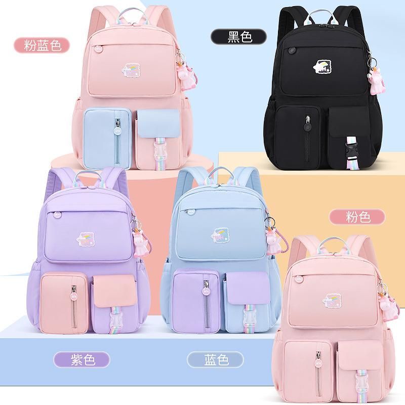 New schoolbags for primary school students grades 1-3-6 waterproof wholesale Korean version of the burden relief ridge cute children's backpack 318 Powder with Blue Large + Tutorial Bag