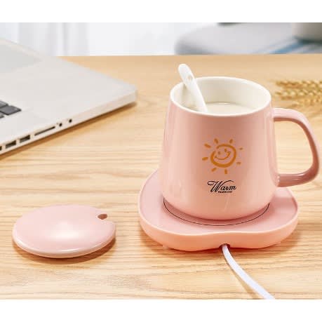 Coffee Cup With Saucer Spoon And A Warmer